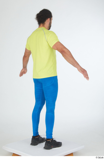 Simeon A poses black sneakers blue leggings dressed sports standing…